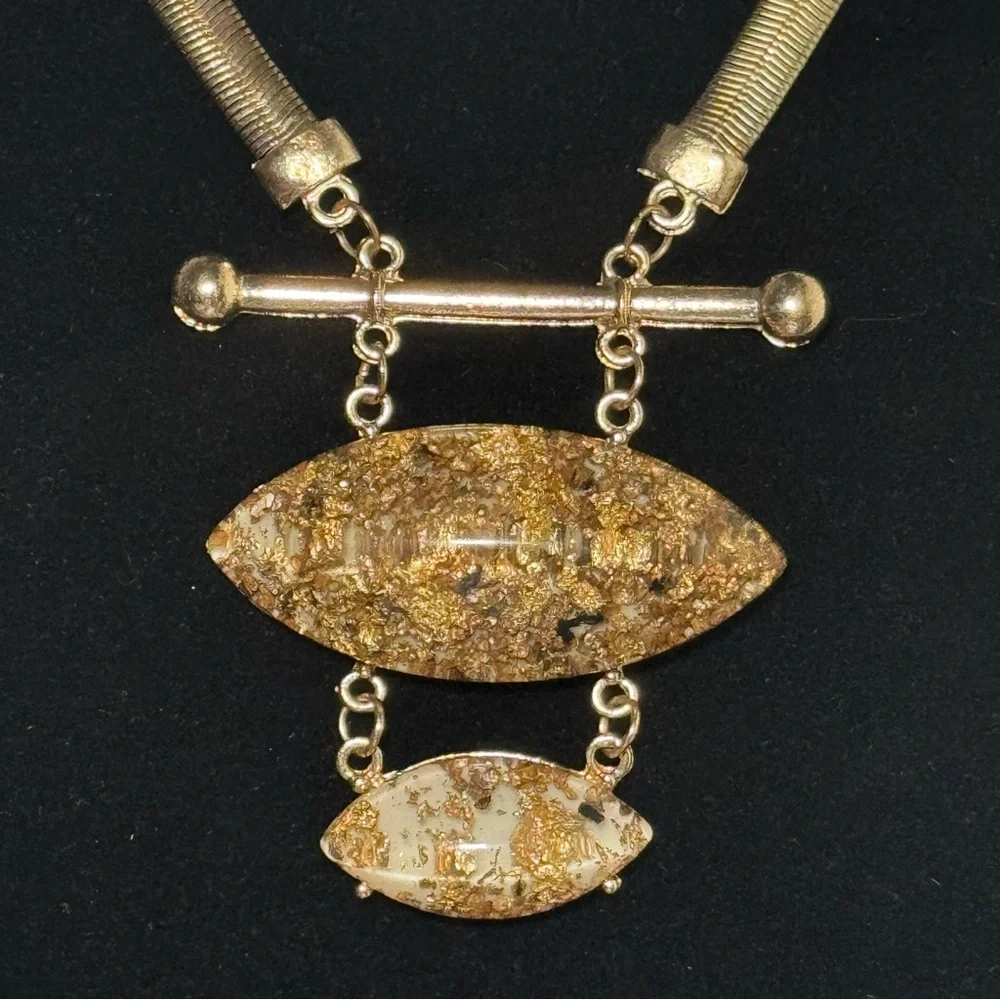 Elegant Gold Necklace with Textured Pendants